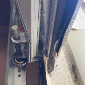 Professional Garage Door - Door split open from being driven - Garage Door Services Near Me - Sheridan, Illinois Professional Garage Door - Door split open from being driven - Garage Door Services Near Me - Sheridan, Illinois