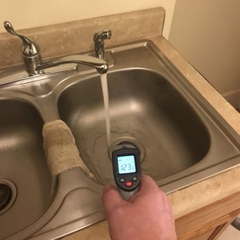 Ernst Home Inspections - Getting a hot water temp reading to document the water temperature in the inspection report. - Home Inspectors Near Me Ernst Home Inspections - Getting a hot water temp reading to document the water temperature in the inspection report. - Home Inspectors Near Me