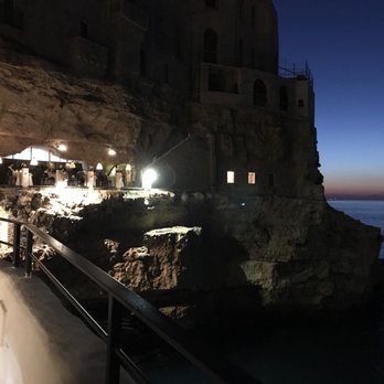 Grotta Palazzese - Emerging from staircase to the restaurant. - Italian Near Me - Polignano A Mare, BA Grotta Palazzese - Emerging from staircase to the restaurant. - Italian Near Me - Polignano A Mare, BA