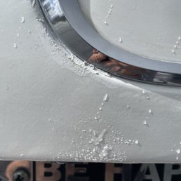 Looks like water but it's actually paint sprayed on top of original paint and stuck Looks like water but it's actually paint sprayed on top of original paint and stuck