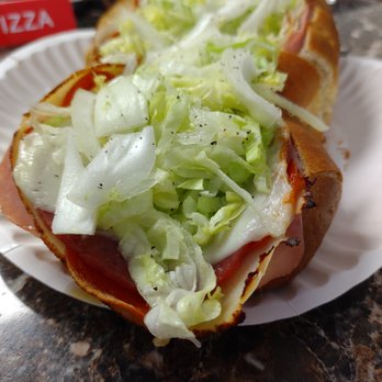 Tippi's Pizzeria - a hot dog with lettuce and tomato - Pizza Near Me - West Palm Beach, Florida Tippi's Pizzeria - a hot dog with lettuce and tomato - Pizza Near Me - West Palm Beach, Florida