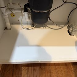 Pro Restoration Solutions - final result of kitchen sink cabinet floorboard replacement.