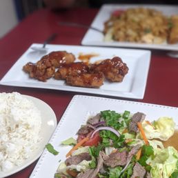Thai beef salad, tamarind crispy chicken wings and drunken noodles with shrimp. Thai beef salad, tamarind crispy chicken wings and drunken noodles with shrimp.