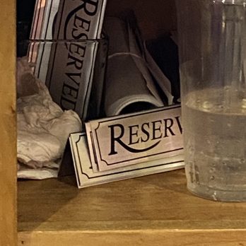 Popovers - a glass of water on a shelf - Bakeries Near Me - Epping, New Hampshire