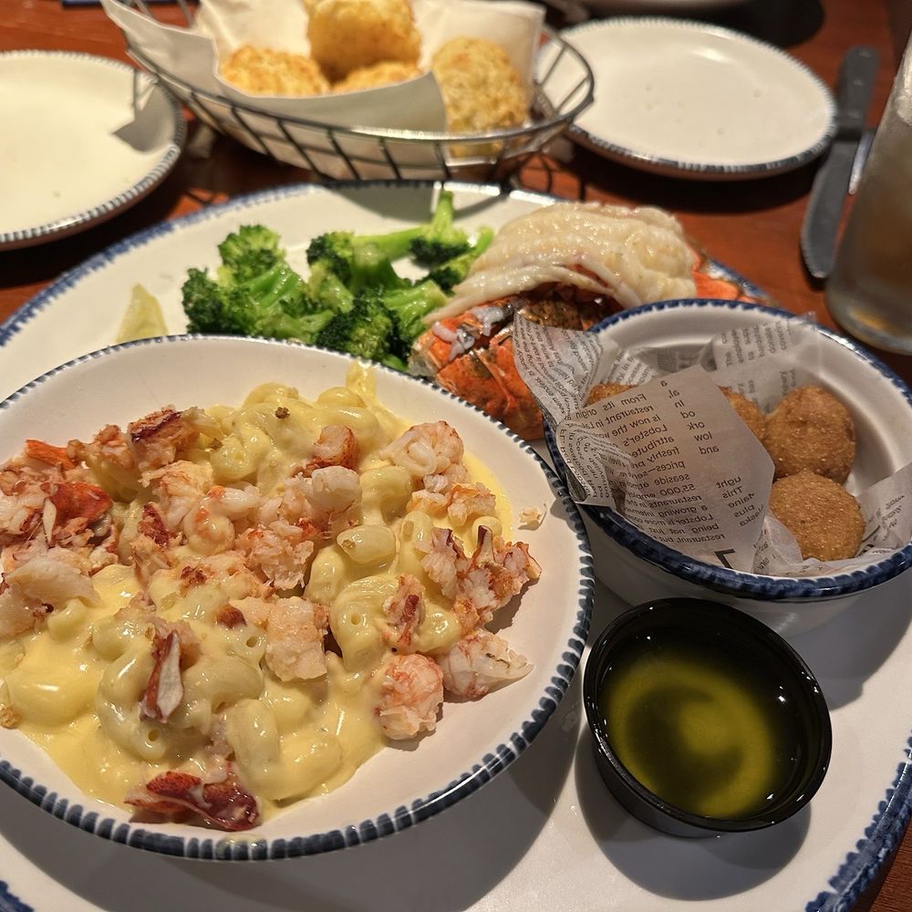 Lobster Fest plate with lobster mac and cheese, Maine lobster tail, steamed broccoli and hush puppies. Lobster Fest plate with lobster mac and cheese, Maine lobster tail, steamed broccoli and hush puppies.