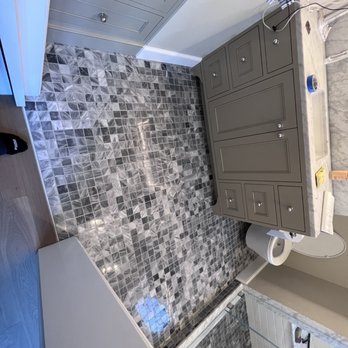 Northwest Artisan Tile Company - Marble floor that continues into the master steam shower - Flooring Near Me - Auburn, Washington Northwest Artisan Tile Company - Marble floor that continues into the master steam shower - Flooring Near Me - Auburn, Washington