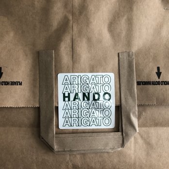 Hando - If you order take out, it comes in this brown bag and cute sticker to seal it. - Sushi Bars Near Me - Houston, Texas Hando - If you order take out, it comes in this brown bag and cute sticker to seal it. - Sushi Bars Near Me - Houston, Texas