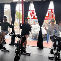 Burn Cycling - Clients on bikes inside studio