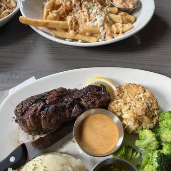 Bonefish Grill - Steak & Crab Cake Crab-Topped Bang Fries - Seafood Near Me - Palm Beach Gardens, Florida Bonefish Grill - Steak & Crab Cake Crab-Topped Bang Fries - Seafood Near Me - Palm Beach Gardens, Florida