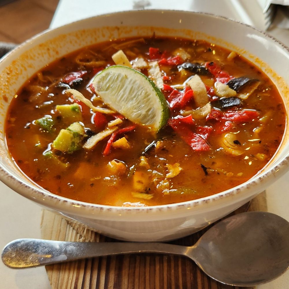 Tula's Kitchen - A bowl of green chile chicken stew. Large enough that some went home for later. - New American Near Me - Albuquerque, New Mexico Tula's Kitchen - A bowl of green chile chicken stew. Large enough that some went home for later. - New American Near Me - Albuquerque, New Mexico