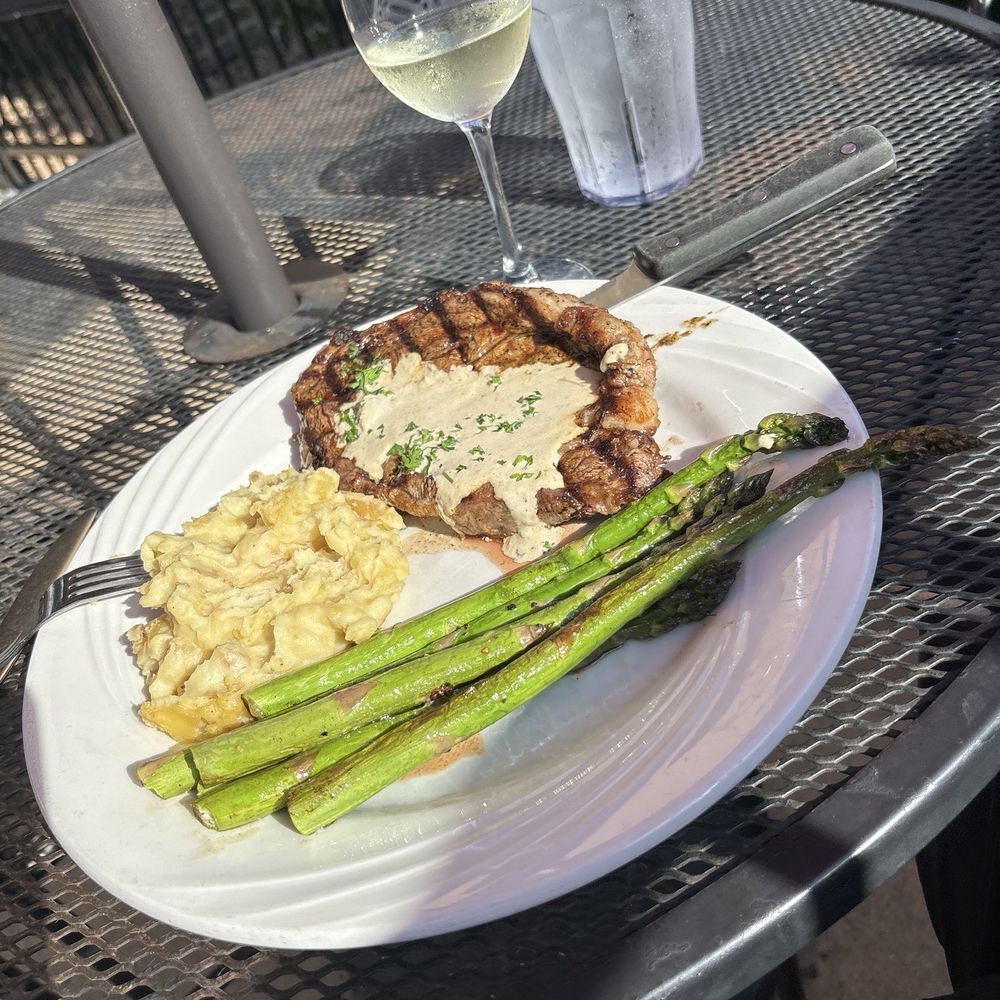 Craft Chophouse & Lounge - Ribeye with blue cheese and horseradish sauce, mashed potatoes, and asparagus. - Italian Near Me - Brookings, South Dakota Craft Chophouse & Lounge - Ribeye with blue cheese and horseradish sauce, mashed potatoes, and asparagus. - Italian Near Me - Brookings, South Dakota