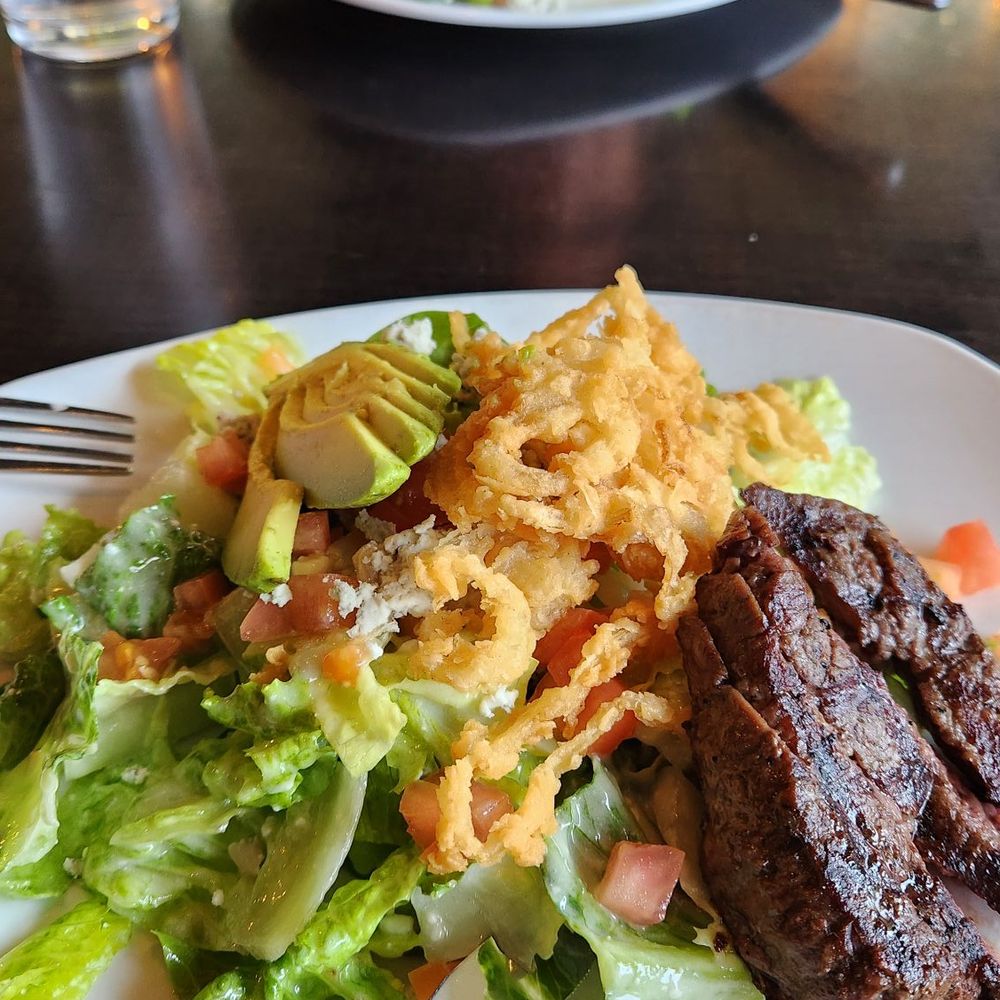 Lake Forest Bar & Grill - Steak salad plated for two. - American Near Me - Lake Forest Park, Washington Lake Forest Bar & Grill - Steak salad plated for two. - American Near Me - Lake Forest Park, Washington