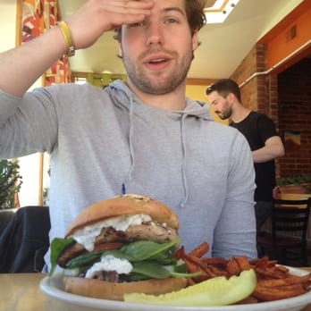 Crow's Nest - Boyfriend with his giant greek chicken burger. - Breakfast & Brunch Near Me - Kalamazoo, Michigan