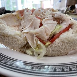 Find the sliver of cheese on a turkey and cheese hoagie