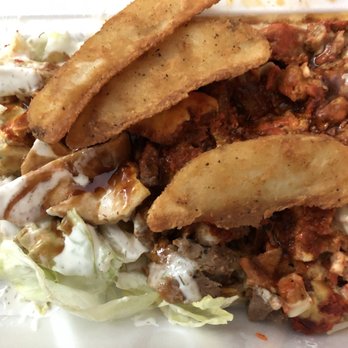 Shah's Halal Food - Mixed rice with chopped pita, kfc fries, kfc special sauce, green sauce, hot sauce, white sauce, bbq sauce. - Halal Near Me - Sunnyside, New York Shah's Halal Food - Mixed rice with chopped pita, kfc fries, kfc special sauce, green sauce, hot sauce, white sauce, bbq sauce. - Halal Near Me - Sunnyside, New York