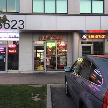 Tim Sushi and Cafe - a car parked in front of a restaurant - Sushi Bars Near Me - Markham, Ontario