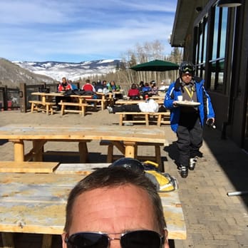 Talon - a man wearing sunglasses and a blue jacket - New American Near Me - Avon, Colorado