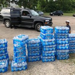 Donating water to Flint Michigan residents.