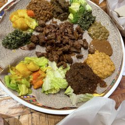 Meat combo and beef tibs served family style