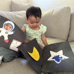 Mission Montessori - Proudly showing off her work from class