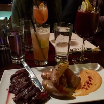 Alchemy - Mouth watering Hangar Steak with fingerling potatoes. Drinks are Smothering Bastard and Sangria - Tapas/Small Plates Near Me - Memphis, Tennessee