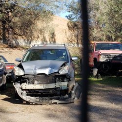 All American Towing - My car was slightly dented on the bumper & running fine when this tow company took it. Brick wall anyone?