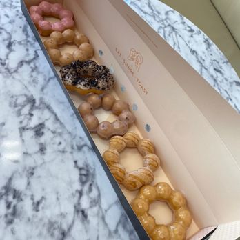 Mochio Mochi Donut - L-R: strawberry, earl grey tea, cookies n cream, blueberry, churro, original glaze - Donuts Near Me - Dallas, Texas