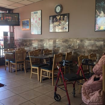Piccolo Pinos Pizzeria - a woman sitting in a chair - Pizza Near Me - Staten Island, New York Piccolo Pinos Pizzeria - a woman sitting in a chair - Pizza Near Me - Staten Island, New York