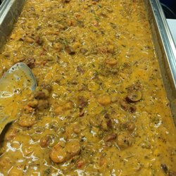 Smittys Catering - Creo dish Crawfish, shrimp sausage, Sautee with onion's bell pepper creamy sauce served over seemed rice.