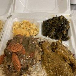 Zodiac Lounge and Grill - We ordered Oxtail and Curry Chicken to go with Greens and Max and cheese..