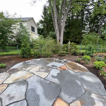 Better View Landscapes - a stone patio in a backyard - Lawn Services Near Me - Hadley, Massachusetts
