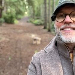Tacoma Chiropractic Health Connection  - Bearded white guy in the Forrest with his little dog in the background
