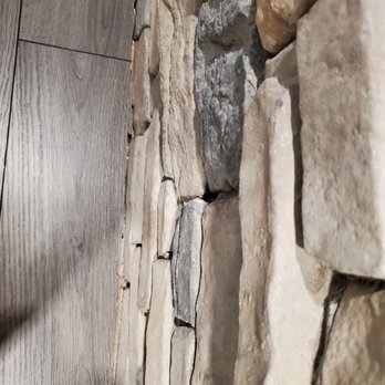 D'Best! Floorz & More - a close up of a stone wall - Flooring Near Me - Orlando, Florida