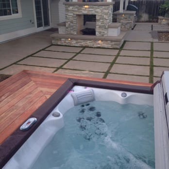Rock and Rose Landscape - Beautiful redwood deck surrounding the spa, and a grass filled seating area in front of the double sided fire place. - Masonry/Concrete Near Me Rock and Rose Landscape - Beautiful redwood deck surrounding the spa, and a grass filled seating area in front of the double sided fire place. - Masonry/Concrete Near Me