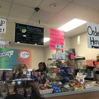 Chamoy Locos - a woman behind the counter - Do-It-Yourself Food Near Me - Dallas, Texas
