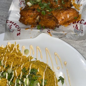 Chicky's - 2 large sides of rice & 1 whole chicken flavored with hot sauce (Chicky's for Everyone) - Portuguese Near Me - Jamaica, New York Chicky's - 2 large sides of rice & 1 whole chicken flavored with hot sauce (Chicky's for Everyone) - Portuguese Near Me - Jamaica, New York