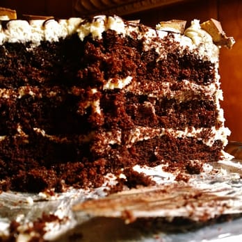 Cupcrazed Cakery - Chocolate cake with peanut buttercream frosting with chocolate drizzle and topped with Reese's Peanut Butter Cups. #halffull - Bakeries Near Me - Fort Mill, South Carolina
