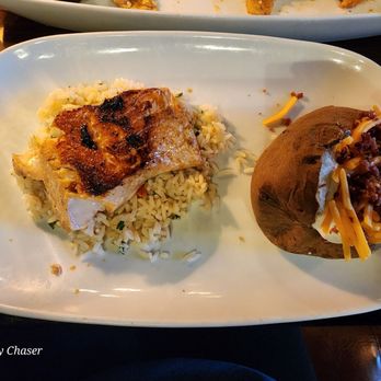 LongHorn Steakhouse - Salmon with rice and loaded Baked Potato - Steakhouses Near Me - Auburn, Maine