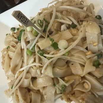 Buddha Thai Bistro - Khua Gai -A dish made with wide rice noodles and soy chicken, bean sprouts, scallion and crushed peanut wok fried with savory garlic sauce - Thai Near Me - Jacksonville Beach, Florida