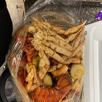 Crazy Crab - crab legs, potatoes, corn, and potatoes in a plastic bag - Seafood Near Me - Pennsauken, New Jersey