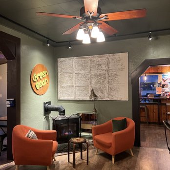 The Green Bean Coffeehouse - two orange chairs and a coffee table - Sandwiches Near Me - Spearfish, South Dakota