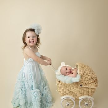 Tazetta Photography - Little girl pushing her baby brother in a vintage pram buggy for photos. - Session Photography Near Me - Blue Ash, Ohio Tazetta Photography - Little girl pushing her baby brother in a vintage pram buggy for photos. - Session Photography Near Me - Blue Ash, Ohio