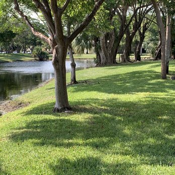 BrightView Landscapes - a park with a pond and trees - Tree Services Near Me - Dania Beach, Florida BrightView Landscapes - a park with a pond and trees - Tree Services Near Me - Dania Beach, Florida