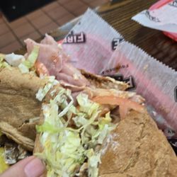 Firehouse Subs - Torn in half because it wasn't cut.