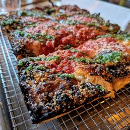 Emmy Squared Pizza - Durham - MVP small pizza (8x10). $18. Housemade vodka sauce, red sauce, parsley pesto, sesame seed crust. - pesto, food, bbq ribs, parsley pesto, parsley, ribs - Pizza Near Me - Durham, North Carolina
