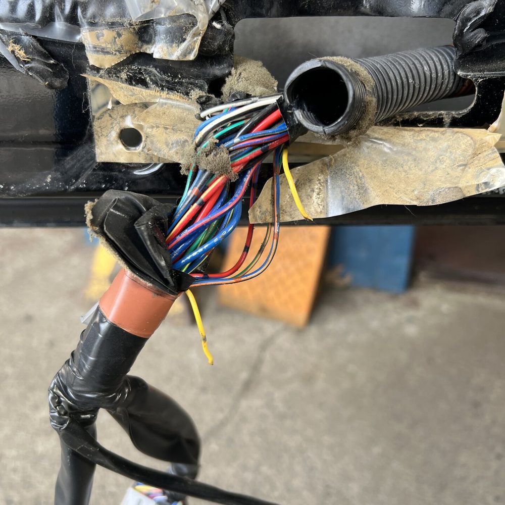Auto Electric Specialties - If you look close, you can see the burn arc on the yellow wire. This has been reconnected, wrapped, and put back exactly HOW it should be. - Auto Repair Near Me - Portland, Oregon