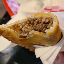 Delicias Boricuas - The Meat Empanada (Pastelillo) from a top view.