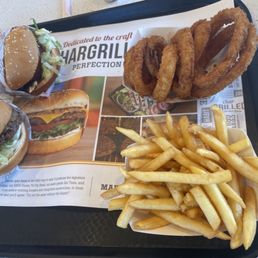 Charburger, teriyaki burger, onion rings and fries Charburger, teriyaki burger, onion rings and fries