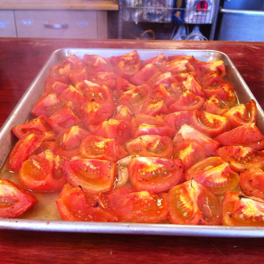 Chef On A Passport - Roasted tomatoes and garlic - straight out of the oven.  You can still see the steam rising!! - Food Tours Near Me - Redondo Beach, California