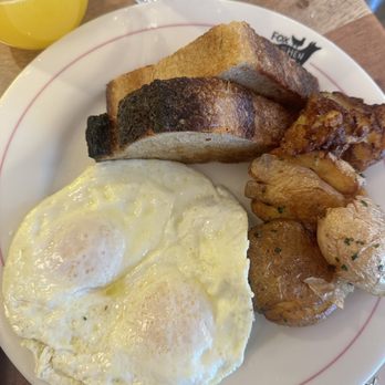 Fox And The Hen - Over easy eggs potatoes and sourdough bread - Breakfast & Brunch Near Me - Denver, Colorado